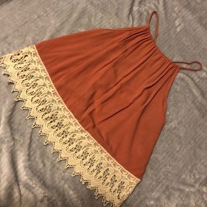 Coral top with crochet detailing on the bottom